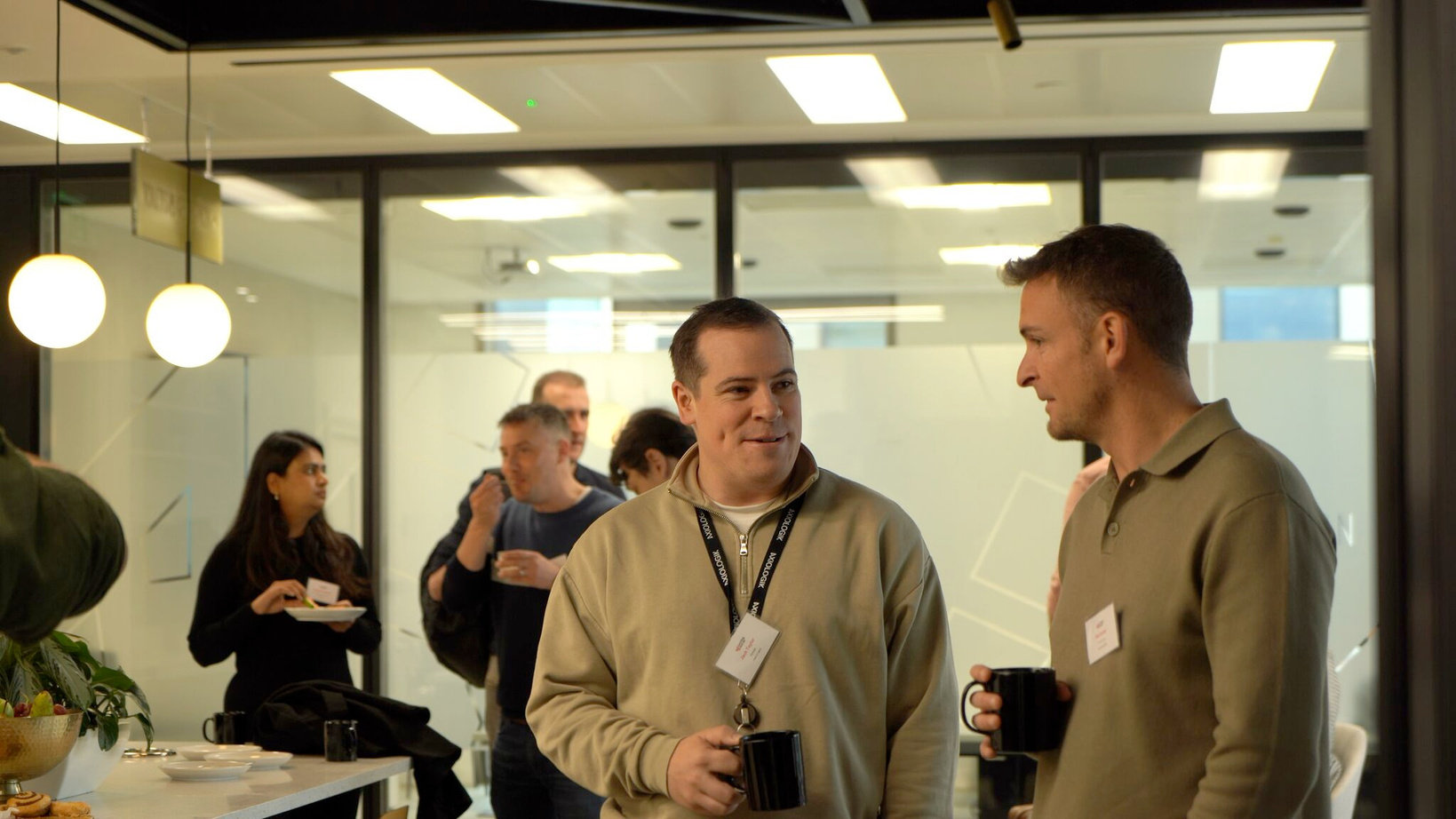 Attendees chatting at a previous Sourcing Social event